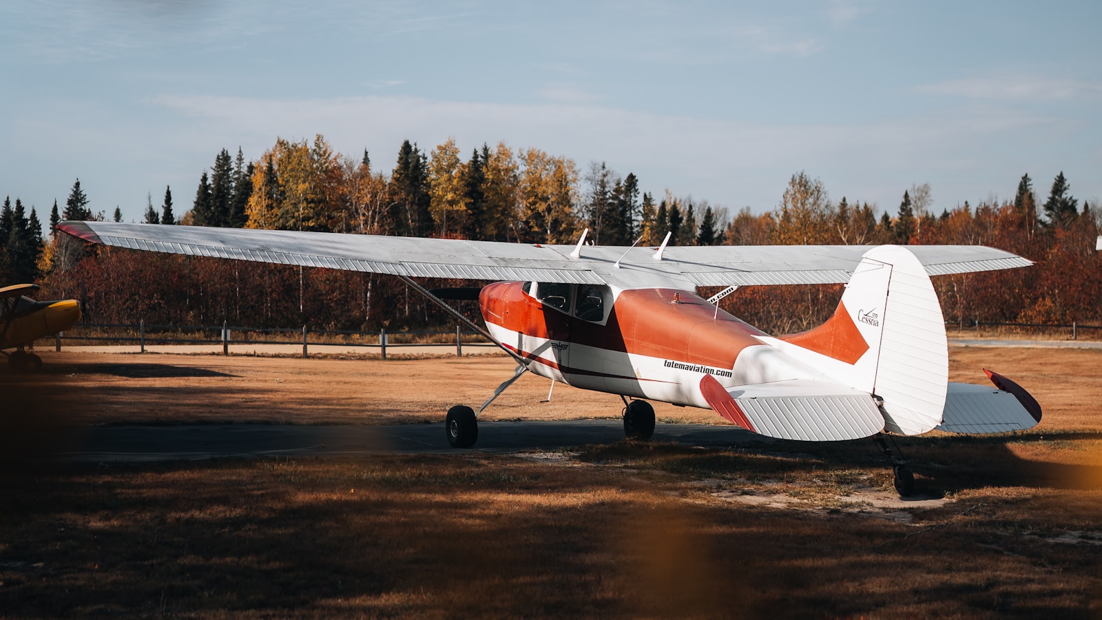 A small single-engine prop airplane on a rural airstrip — the year-in-review of a network spanning small towns across North America.